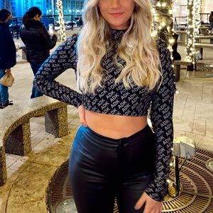 Adika cropped tight fit top. ADK silver lettering.